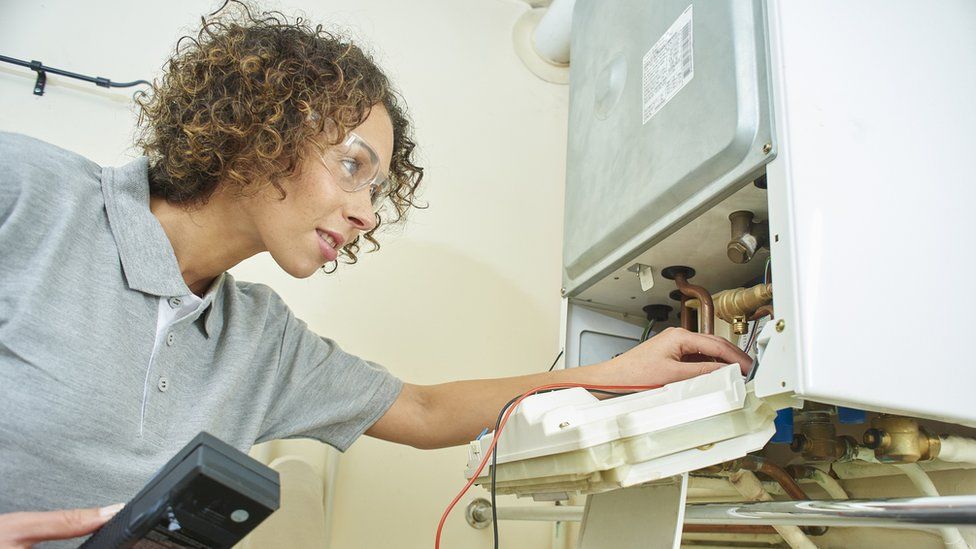 Engineer inspecting a boiler